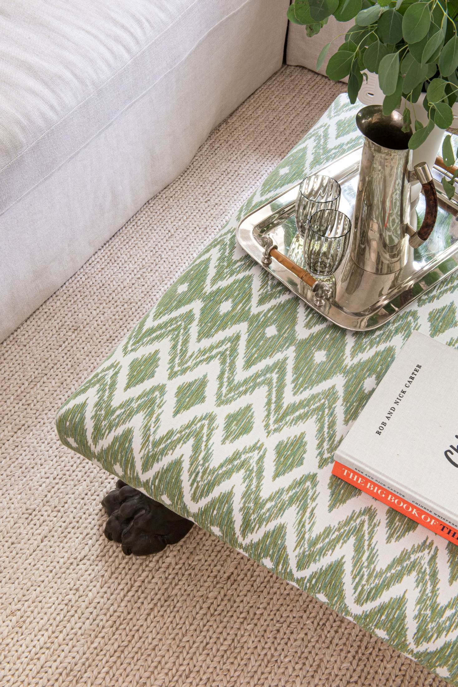 Bold colourful green patterned ottoman in London sitting room